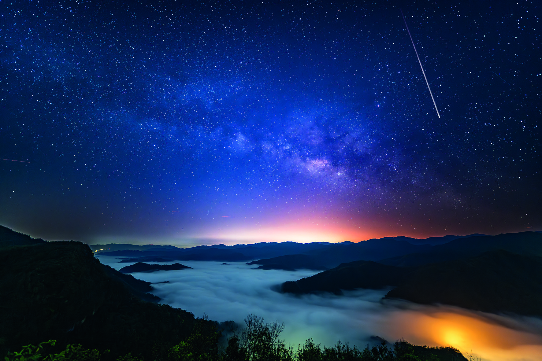 Milky Way starry night with mountains and sea of clouds. Taiwan.